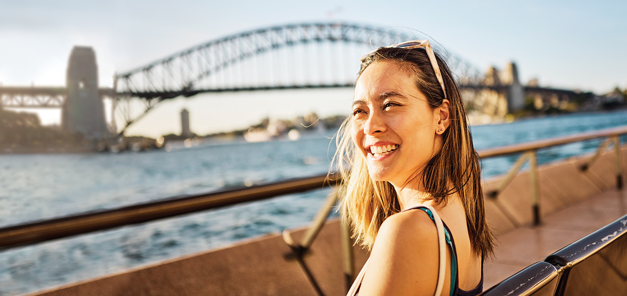 Woman in front of the Sydney Harbour Bridge