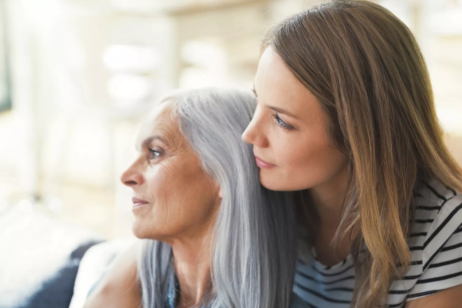 Woman hugging an older woman