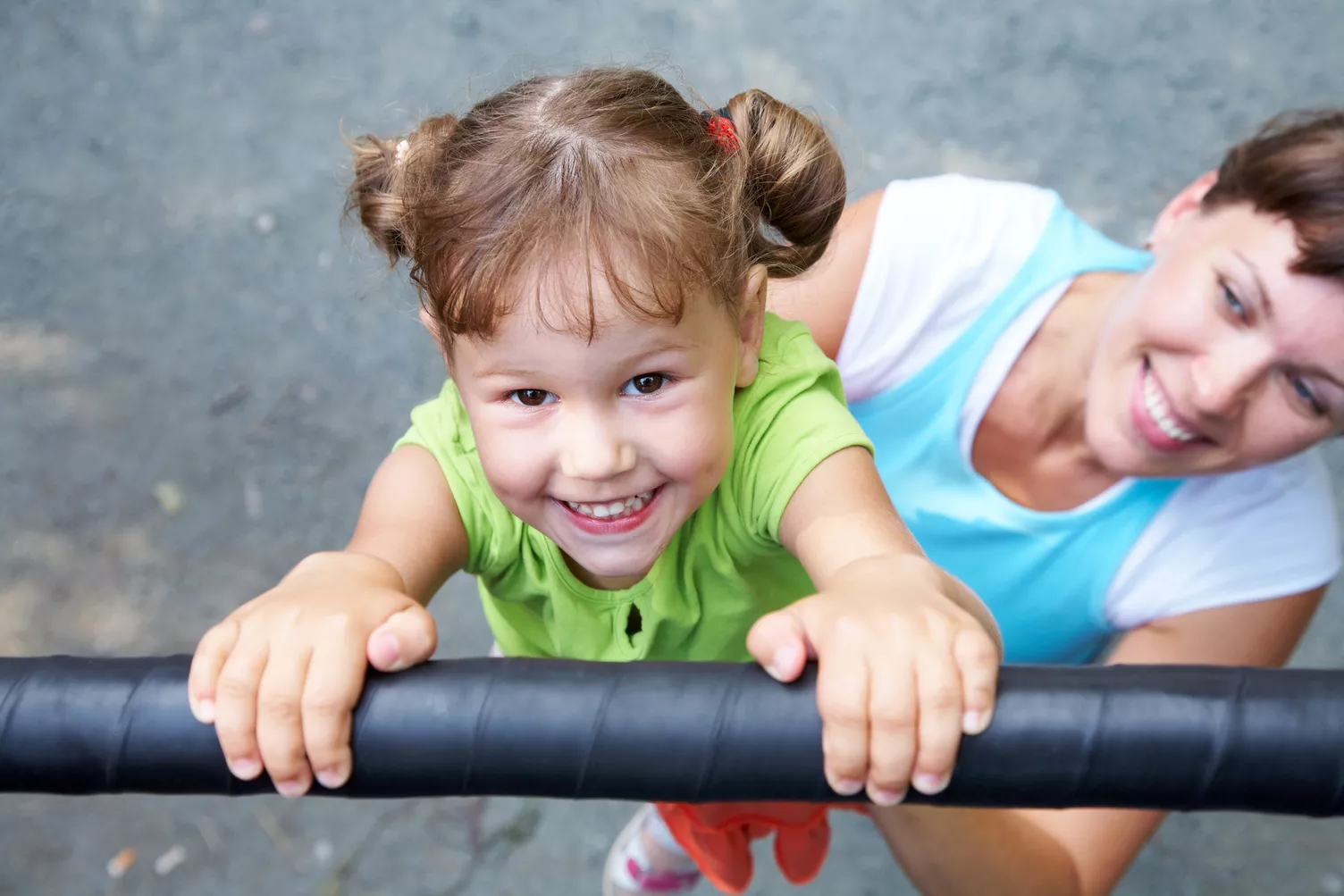 mother playing with her child at playground