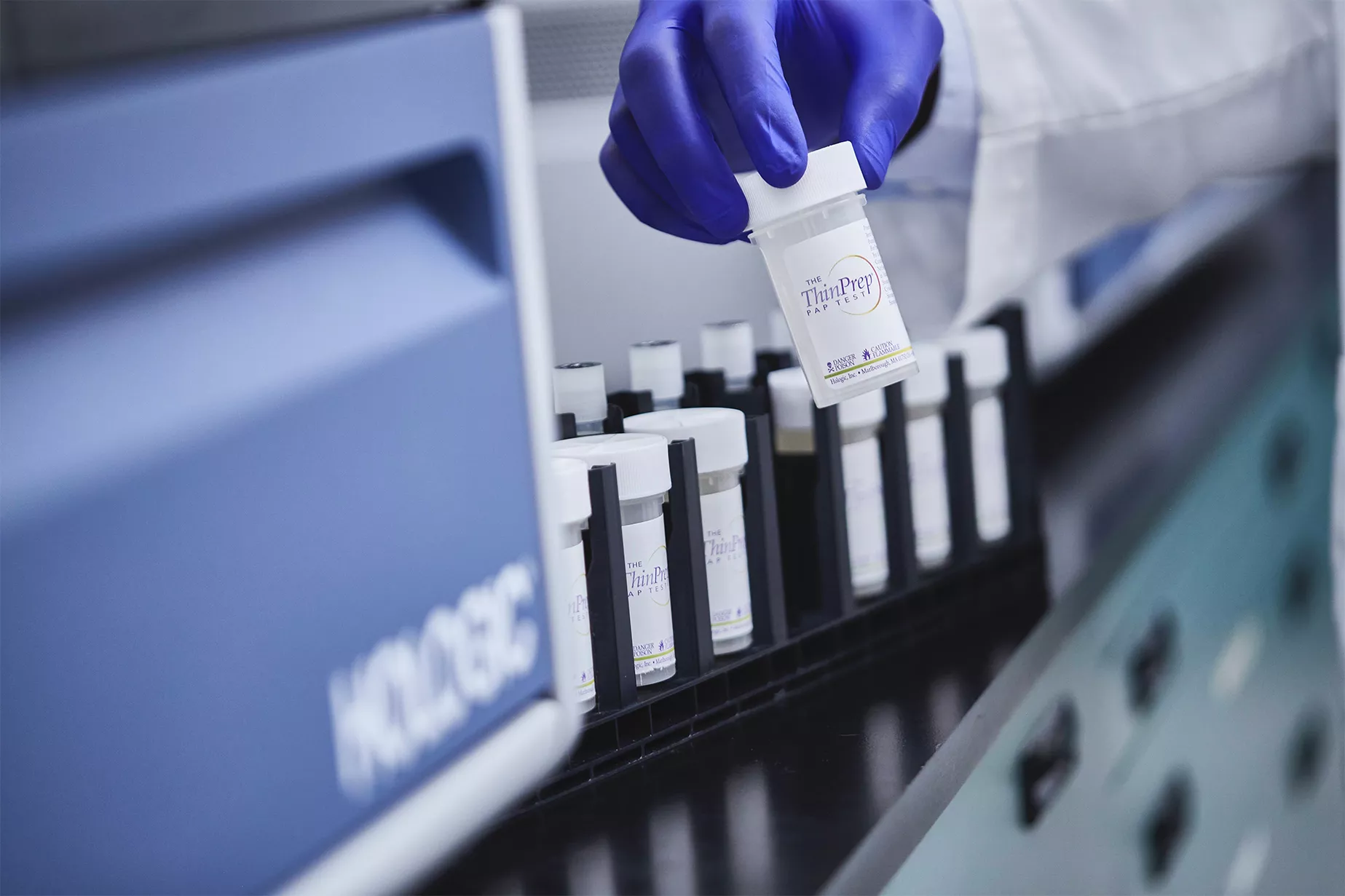 Physician holding tube in lab setting